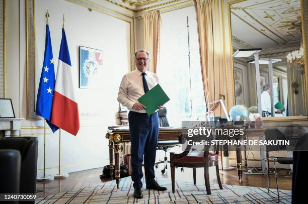 President of the French National Assembly Richard Ferrand poses in his office during a photo session at the French National Assembly in Paris on May...