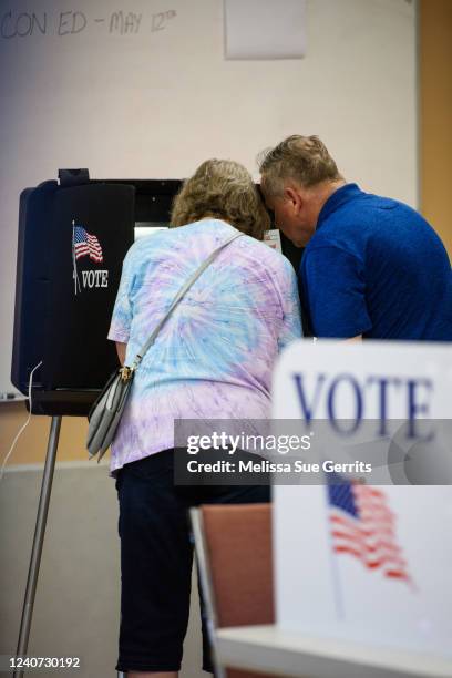 Couple fill out their ballots during Primary day on May 17, 2022 in Belews Creek, North Carolina. Residents are voting for who they want to replace...