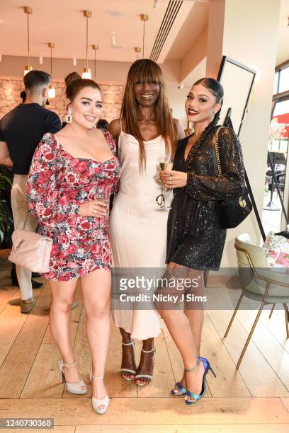 Amy Christophers, Angel Sinclair and Alexis Economou attend the Amanda Akokhia Models of Diversity exhibition charity dinner on May 17, 2022 in...