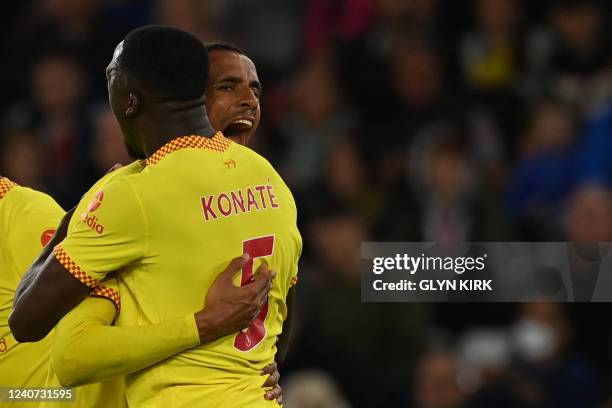 Liverpool's German-born Cameroonian defender Joel Matip celebrates with teammates after scoring his team second goal during the English Premier...