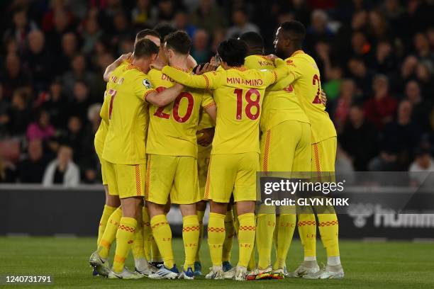 Liverpool's German-born Cameroonian defender Joel Matip celebrates with teammates after scoring his team second goal during the English Premier...