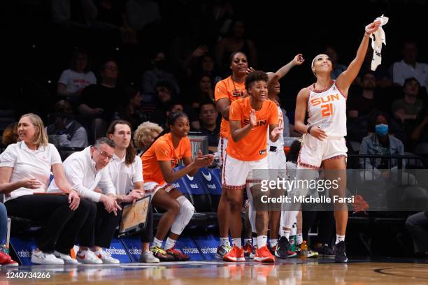The Connecticut Sun celebrate from the bench during the game against the New York Liberty on May 17, 2022 at at Barclays Center in Brooklyn, New...