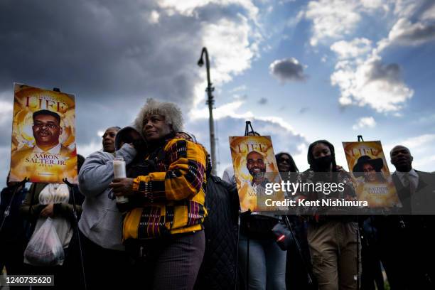 Drea DNur, and Cariol Horne attend a vigil across the street from Tops Friendly Market at Jefferson Avenue and Riley Street on Tuesday, May 17, 2022...