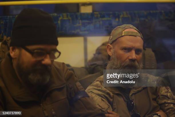 Surrendered servicemen of Ukraine's national battalion "Azov", which is an all-volunteer infantry military unit, are being transferred to Yelenovka...