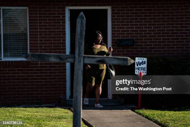 May 17 : Latoya Weston departs after voting passing by a cross outside the Greater New Zion Baptist Church polling location for the North Carolina...