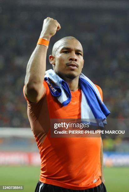 Netherlands' midfielder Nigel de Jong acknowledges the crowd after defeating Brazil 2-1 in their 2010 World Cup quarterfinal football match and...