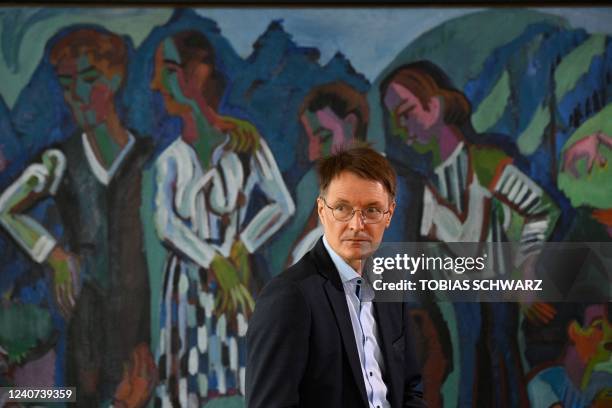 German Health Minister Karl Lauterbach looks right at the start of the weekly cabinet meeting at the Chancellery in Berlin on May 18, 2022.