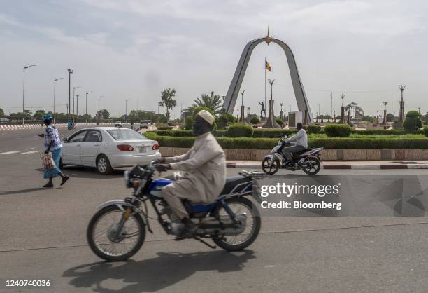 Morning commuters pass the Place de La Nation monument in N'Djamena, Chad, on Tuesday, May 10, 2022. Last year, Chad became the first country to...