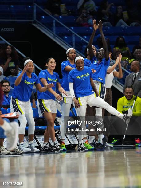 The Dallas Wings bench celebrates during the game against the Washington Mystics on May 17, 2022 at College Park Center in Arlington, TX. NOTE TO...