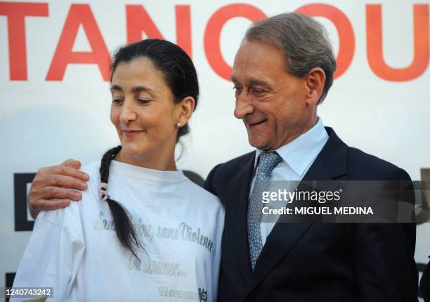 Paris' mayor Bertrand Delanoe hugs Freed French-Colombian hostage Ingrid Betancourt as people gather in front of the Paris' city hall, on July 04,...