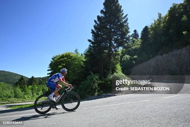 Groupama-FDJ's French rider Thibaut Pinot climbs a hill during a training session at La planche des belles filles, in Plancher-les-Mines, eastern...