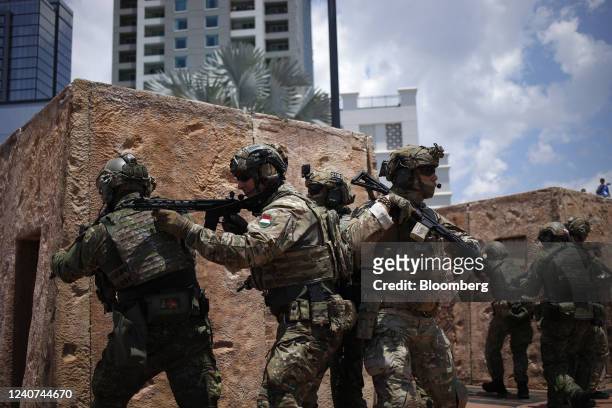 International special operations forces perform a mock hostage rescue during the Special Operations Forces Industry Conference in Tampa, Florida, US,...