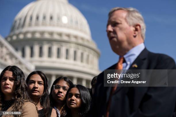 Students with the group Improve The Dream listen as Sen. Dick Durbin and other lawmakers hold a news conference calling for bipartisan legislation to...