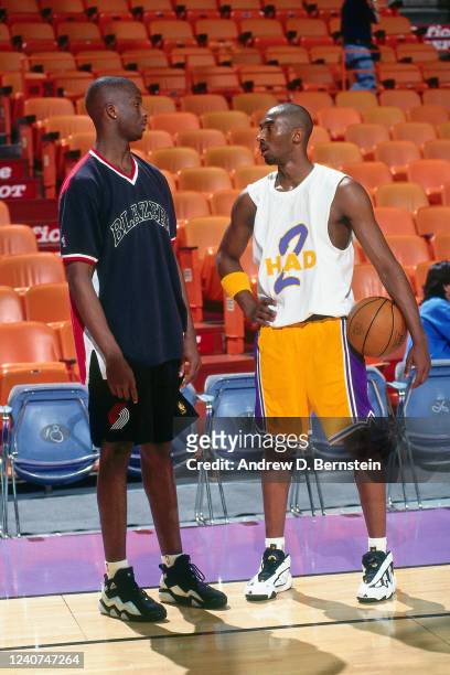 Kobe Bryant of the Los Angeles Lakers speaks with Jermaine O'Neal of the Portland Trail Blazers prior to the game on April 25, 1997 at the Great...