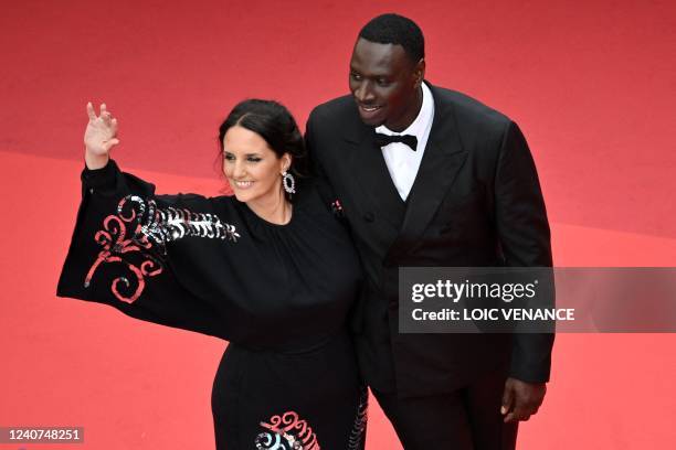 French actor and comedian Omar Sy arrives with his wife Helene Sy for the screening of the film "Father & Soldier " during the 75th edition of the...