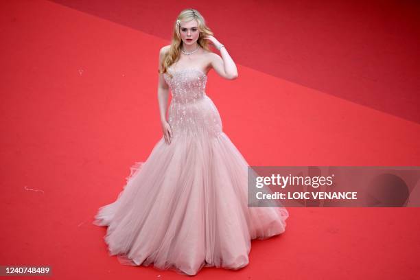 Actress Elle Fanning arrives for the screening of the film "Top Gun : Maverick" during the 75th edition of the Cannes Film Festival in Cannes,...