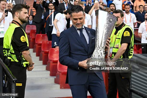 Former Spanish football player Andres Palop holds the UEFA Europa League trophy prior to the final football match between Eintracht Frankfurt and...