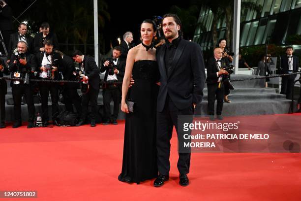 Italian actor Luca Marinelli and his wife German actress Alissa Jung arrive for the screening of the film "The Eight Mountains " during the 75th...