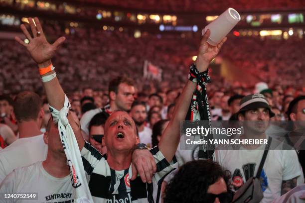 Frankfurt fans react after their team equalized to 1-1 as they watch the UEFA Europa League final football match between Eintracht Frankfurt and...