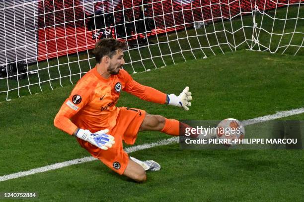 Frankfurt's German goalkeeper Kevin Trapp makes a save from a attempt at goal by Rangers' Welsh midfielder Aaron Ramsey during the UEFA Europa League...