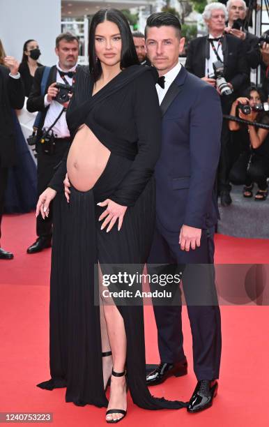 Brazilian model Adriana Lima and Andre Lemmers arrive for screening of the film âTop Gun : Maverickâ at the 75th annual Cannes Film Festival in...