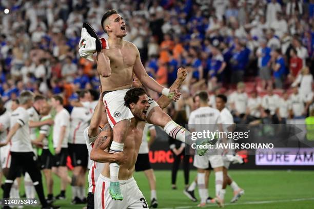 Frankfurt's Colombian striker Rafael Borre and Frankfurt's Portuguese striker Goncalo Paciencia celebrate after winning the UEFA Europa League final...