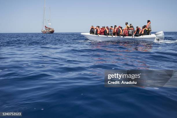 Migrant boat is seen in the SAR zone with Astral on the back offshore Malta on May 17, 2022. The crew of Astral sailboat, of the Spanish NGO Open...