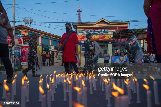 Kashmiri Hindus, locally known as "pandits" light candles during the protest in Budgam against the killing of Rahul Bhat a government employee who...