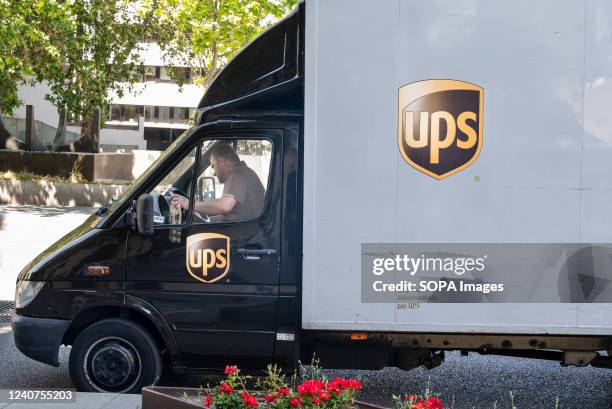 Worker from the American multinational shipping & receiving and supply chain management company, United Parcel Service , is seen on the delivery in...