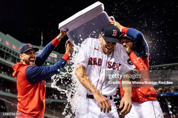 Nick Pivetta of the Boston Red Sox reacts as he is doused with water after pitching a complete game against the Houston Astros on May 18, 2022 at...