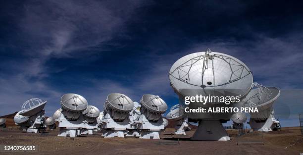View of radio telescope antennas of the Atacama Large Millimeter/submillimeter Array project, at the Chajnantor plateau, in San Pedro de Atacama,...
