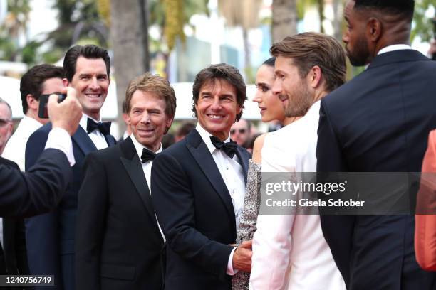 Joseph Kosinski, Jerry Bruckheimer, Tom Cruise and Jennifer Connelly attend the screening of "Top Gun: Maverick" during the 75th annual Cannes film...