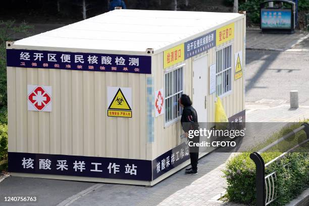 Citizens register for nucleic acid tests at a community gate in Changchun, Jilin Province, on May 18, 2022. The whole process is fast, convenient and...