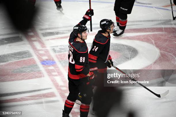 Carolina Hurricanes Right Wing Martin Necas and Carolina Hurricanes Winger Seth Jarvis participate in the storm surge after game 1 of the second...