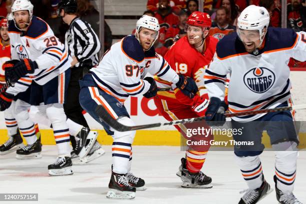 Matthew Tkachuk of the Calgary Flames skates against Connor McDavid of the Edmonton Oilers in Game One of the Second Round of the 2022 Stanley Cup...