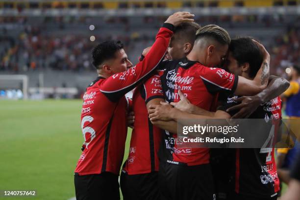 Julio Furch of Atlas celebrates with teammates after scoring his team's first goal during the semifinal first leg match between Atlas and Tigres UANL...