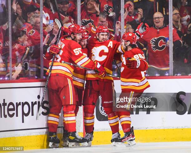 Blake Coleman of the Calgary Flames celebrates with his teammates after scoring against the Edmonton Oilers during the second period of Game One of...