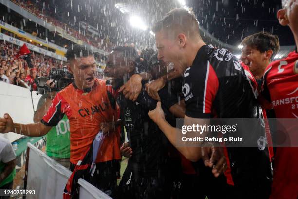 Julian Quiñones of Atlas celebrates with teammates after scoring his team's third goal during the semifinal first leg match between Atlas and Tigres...