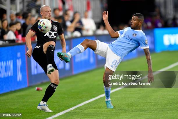 United defender Brad Smith and New York City FC forward Thiago Eduardo de Andrade play a ball in the air during the New York City FC versus D.C....