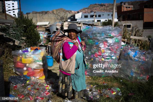 Zenobia Castillo , an Aymara woman recycler, loads part of the material she got from the garbage dumps into an Aguayo in La Paz, Bolivia on May 18,...