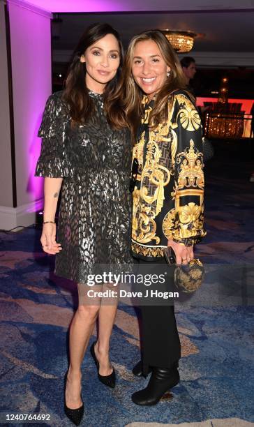Natalie Imbruglia and Melanie Blatt attend The Ivor Novello Awards 2022 at The Grosvenor House Hotel on May 19, 2022 in London, England.
