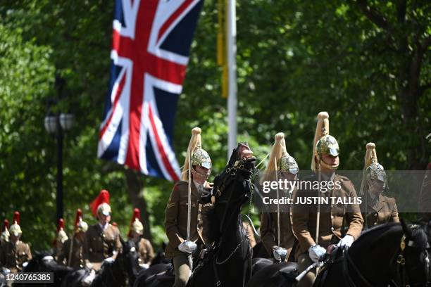 Troops of the Household Cavalry take part in the final rehearsal of the Trooping the Colour, the Queen's annual birthday parade, in London on May 19,...