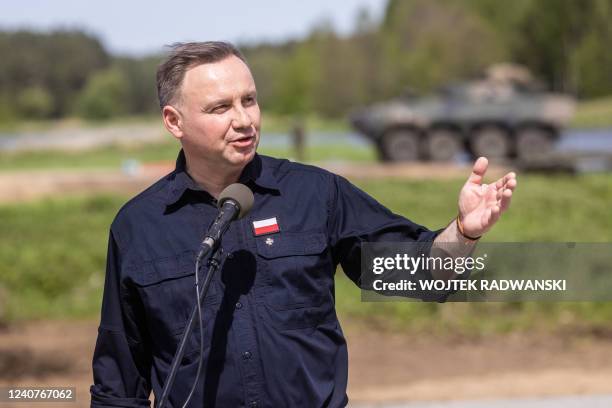Polish President Andrzej Duda speak to soldiers as troops from Poland, USA, France and Sweden take part in the DEFENDER-Europe 22 military exercise,...