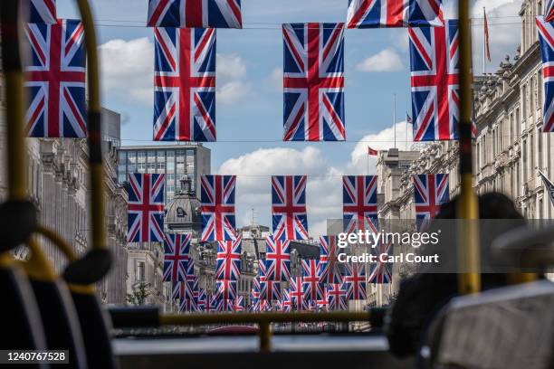 British Union Jack flags are displayed along Regent Street to mark the forthcoming Platinum Jubilee of Queen Elizabeth II, on May 19, 2022 in London,...