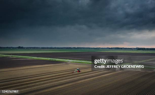 An aerial photo shows flooded fields after heavy rainfall in 's-Gravendeel in the southern part of The Netherlands, on May 19, 2022. - After a long...