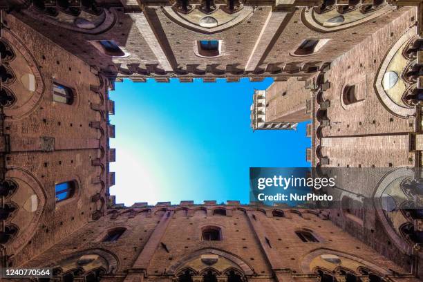 An interior view of Palazzo Civico Palace and Torre del Mangia tower in Siena , Italy, on may 16, 2022. Siena is universally known for its large...