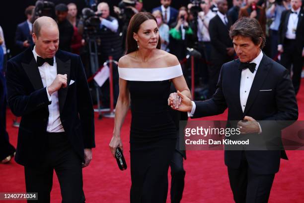 Prince William, Duke of Cambridge and Catherine, Duchess of Cambridge are accompanied by star actor Tom Cruise as they arrive for the "Top Gun:...