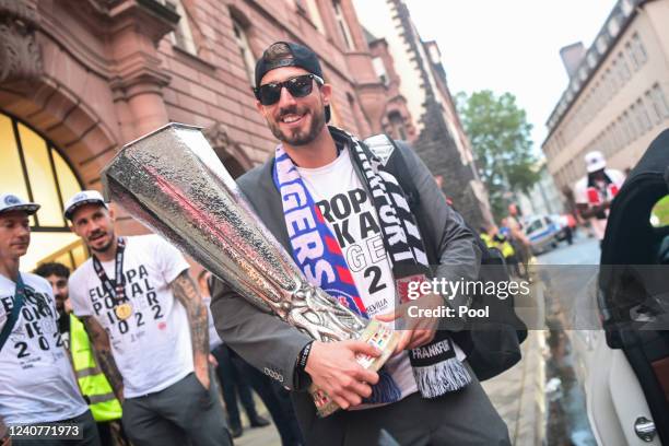 Frankfurt goalkeeper Kevin Trapp carries the trophy during the official celebration of winning the UEFA Europa League Final 2021/22 at Frankfurt City...