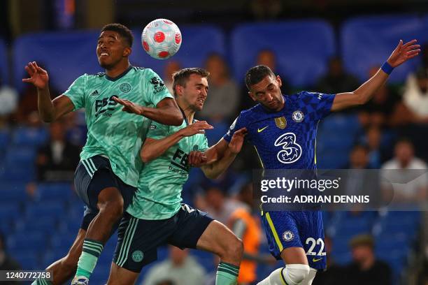 Chelsea's Moroccan midfielder Hakim Ziyech vies with Leicester City's French defender Wesley Fofana and Leicester City's Belgian defender Timothy...