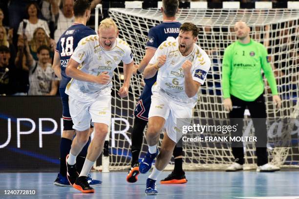 Kiel's Patrick Wiencek and THW Kiel's Harald Reinkind during the EHF Champions League quarter-final 2nd-leg handball match THW Kiel v Paris...